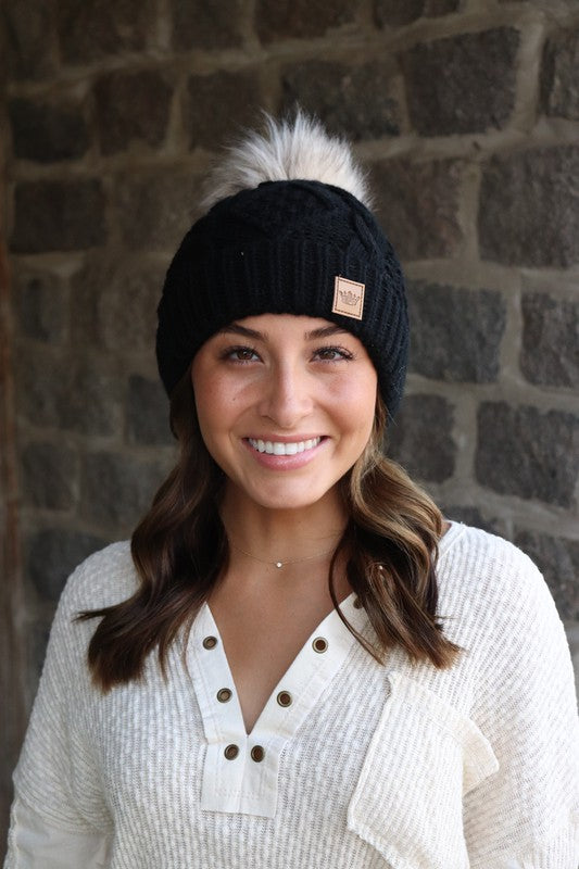 Black fleece lined cable knit hat with pom